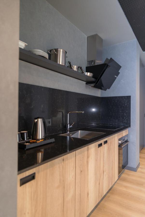 Mk Hotel Tirana Rinas Eksteriør bilde A kitchen in a serviced apartment in Paris